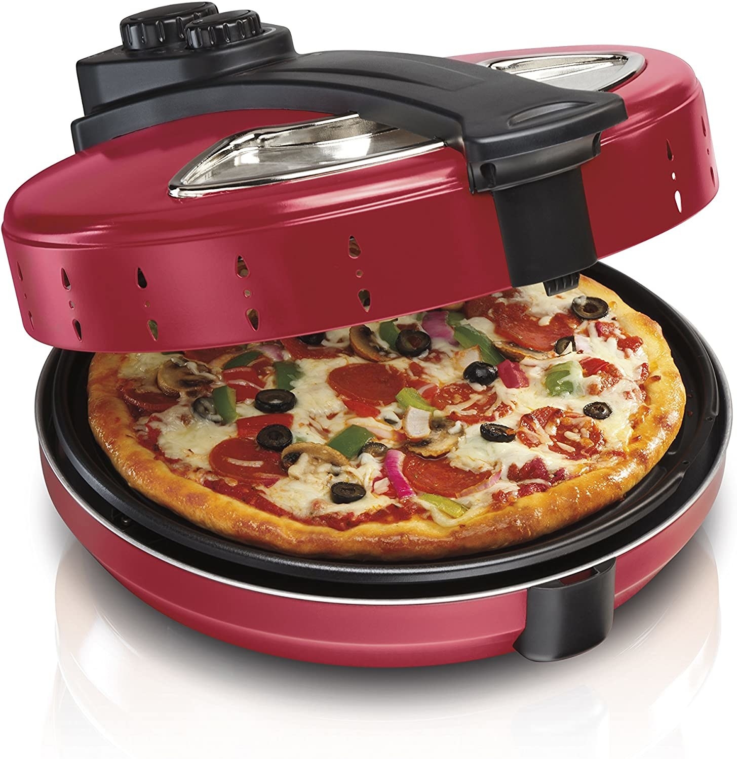 A pizza inside the pizza maker