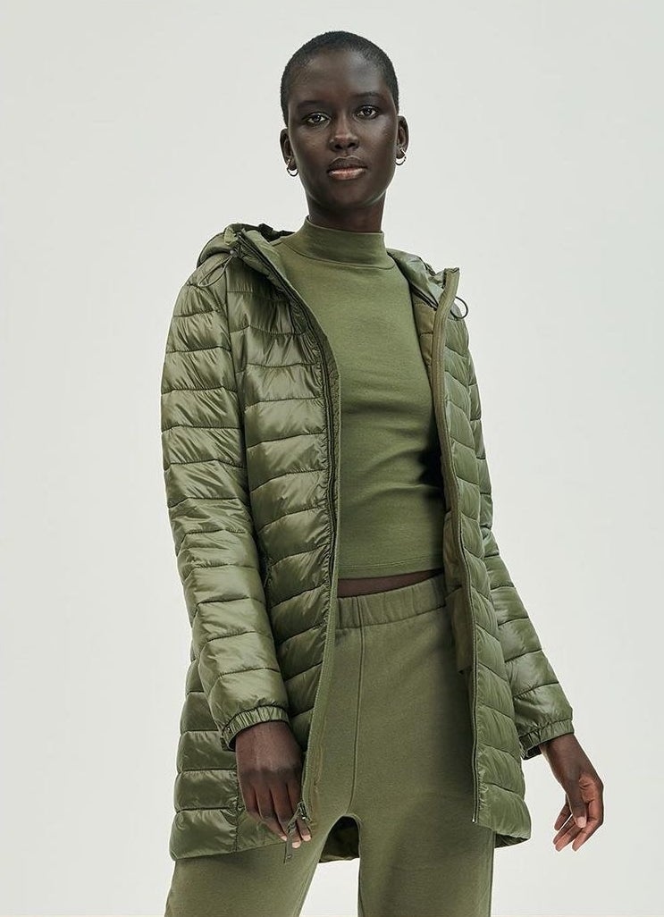 a model wearing the lightweight puffer while looking into the camera