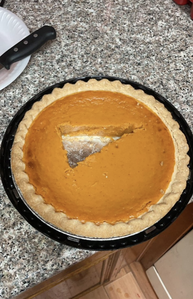 A slice of pie cut out of the middle of the pie