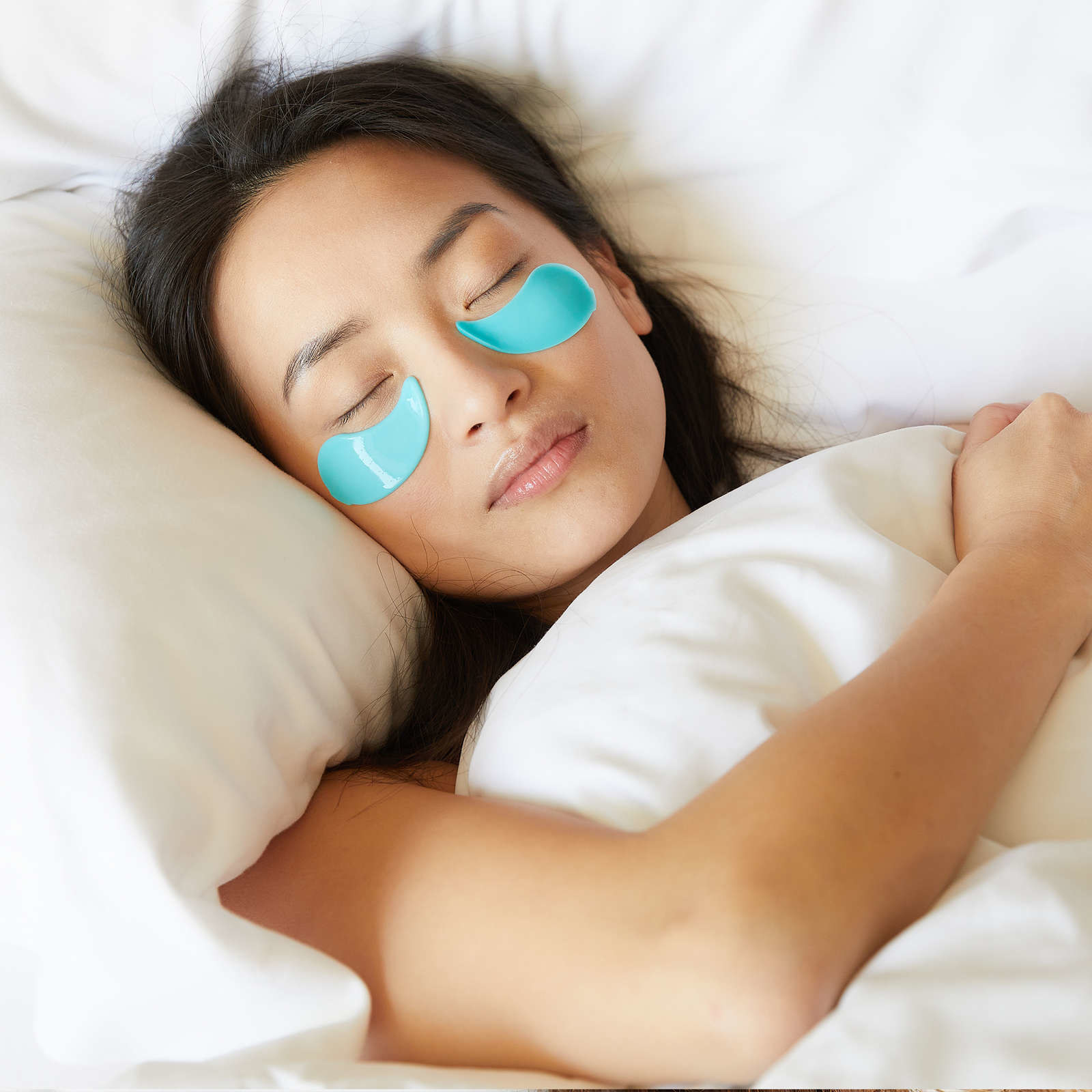a sleeping person wearing the eye masks