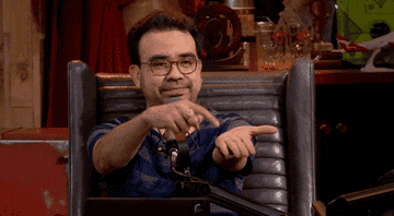 a gif of a person tapping their palm and saying gimme