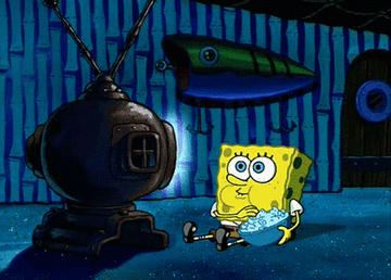 spongebob eating popcorn and watching tv in a gif