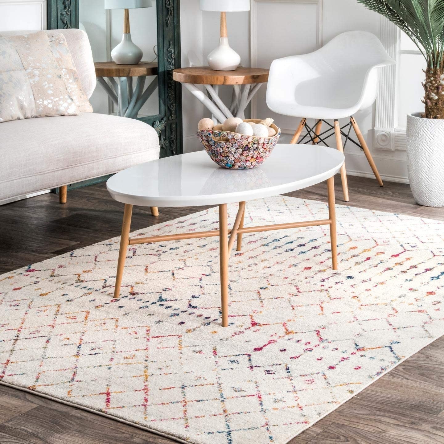 the cream rug with a multi-colored geometric print