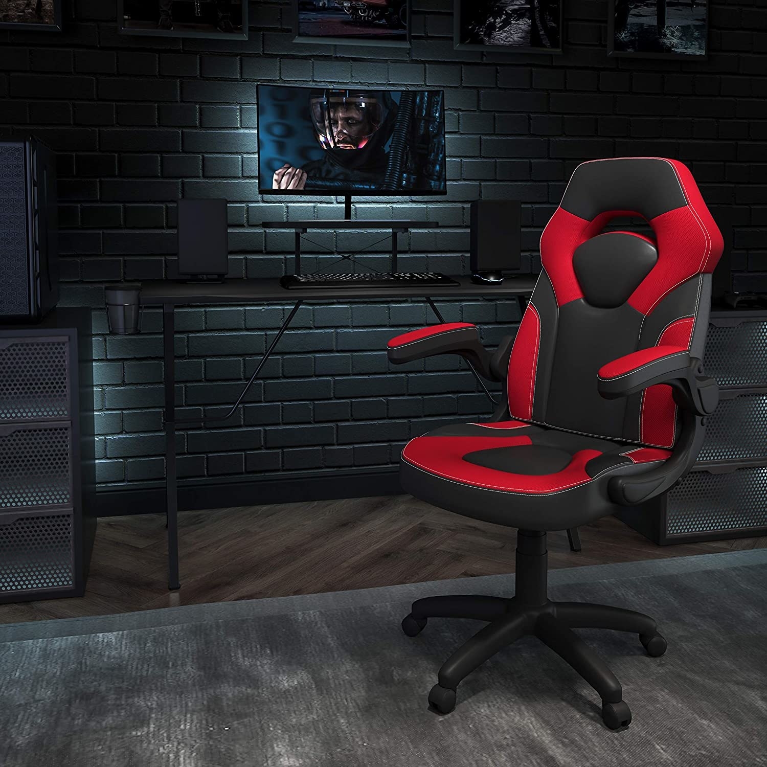 red and black gaming chair in front of a screen