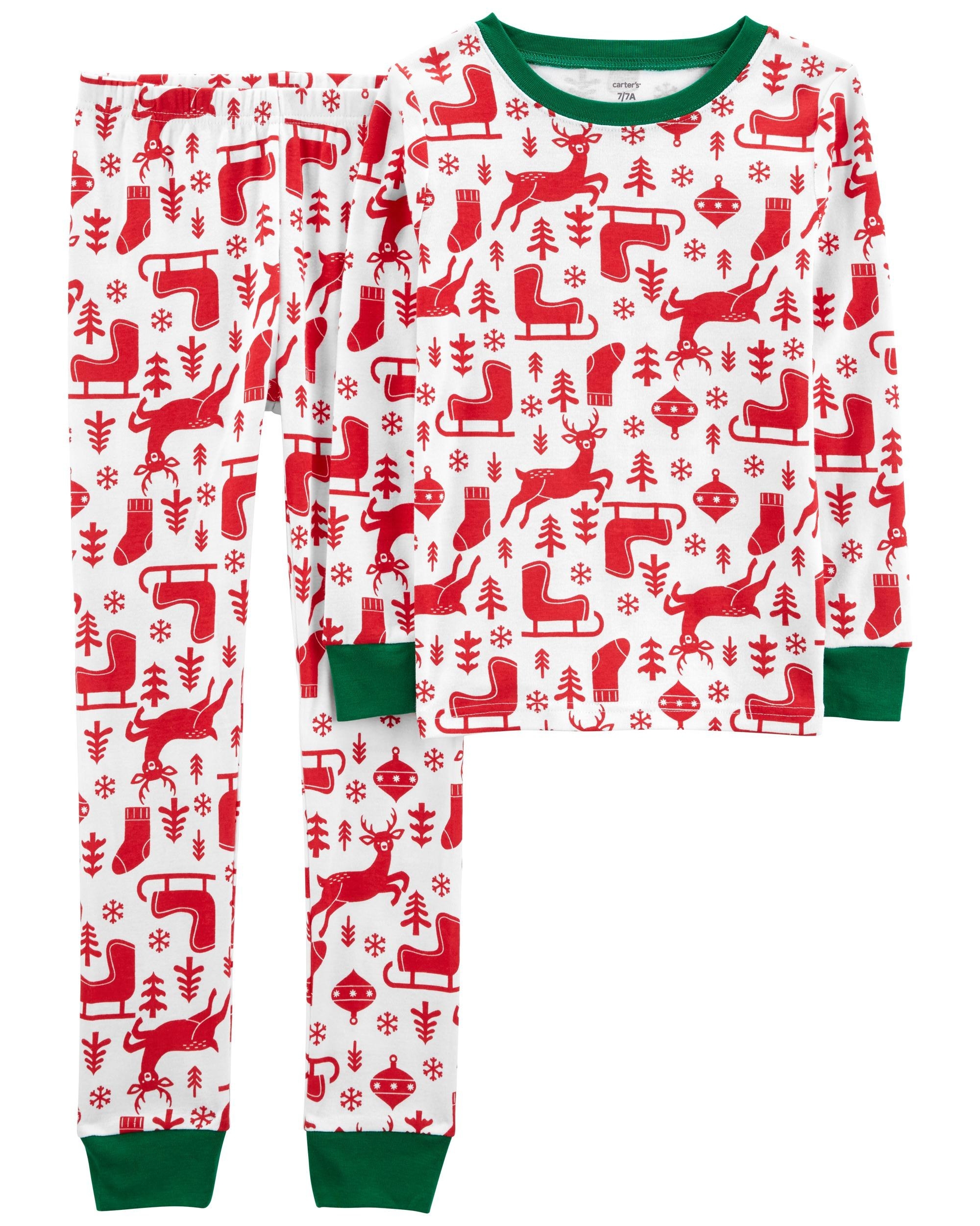 white pajama set with red reindeers, sleighs, ornaments, and trees on it, and a green trim