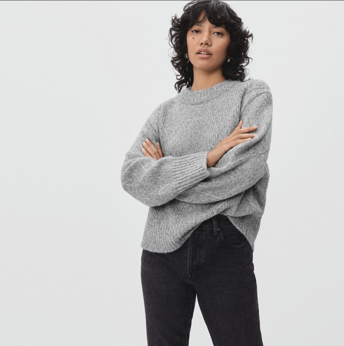 Model wearing the grey sweater