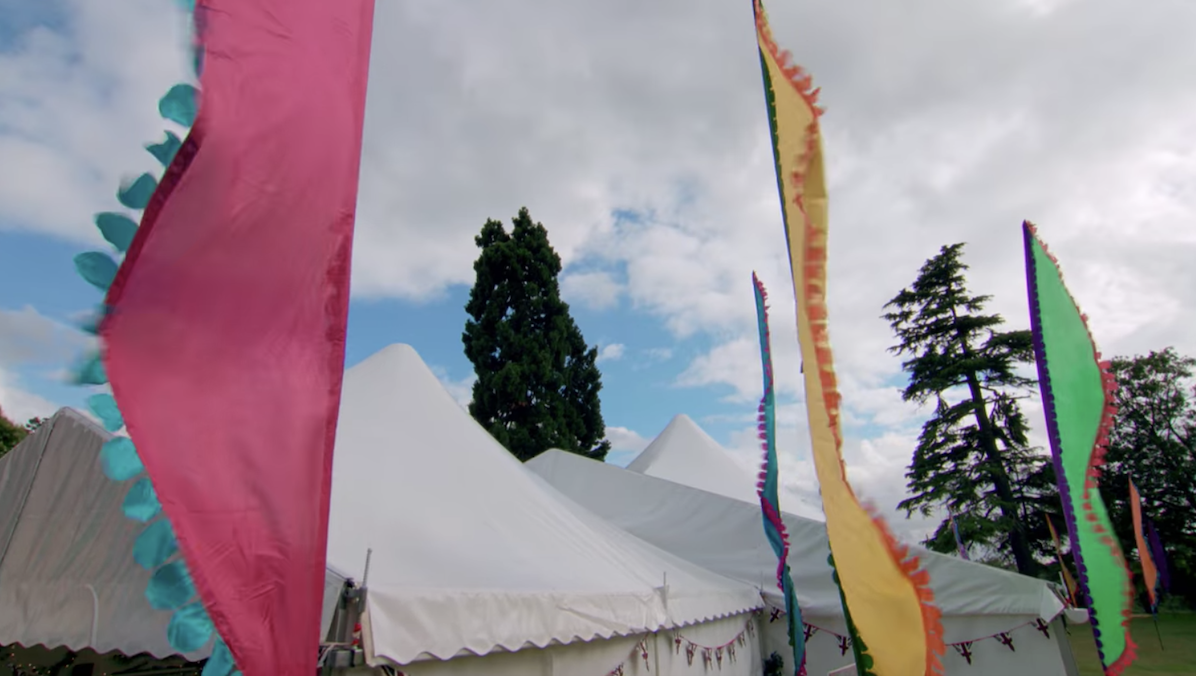 Colorful banners outside the tent