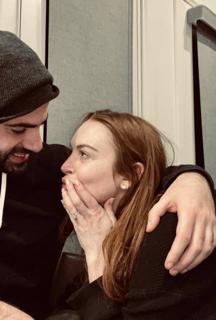Lindsay and Bader embracing after getting engaged