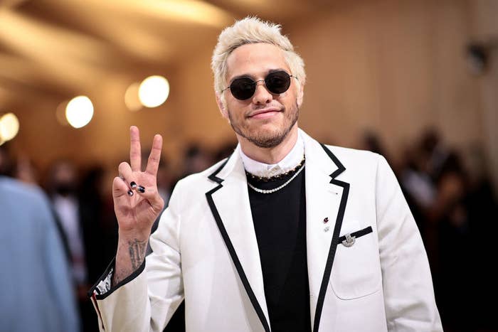 Pete giving the peace sign on the red carpet of the 2021 Met Gala