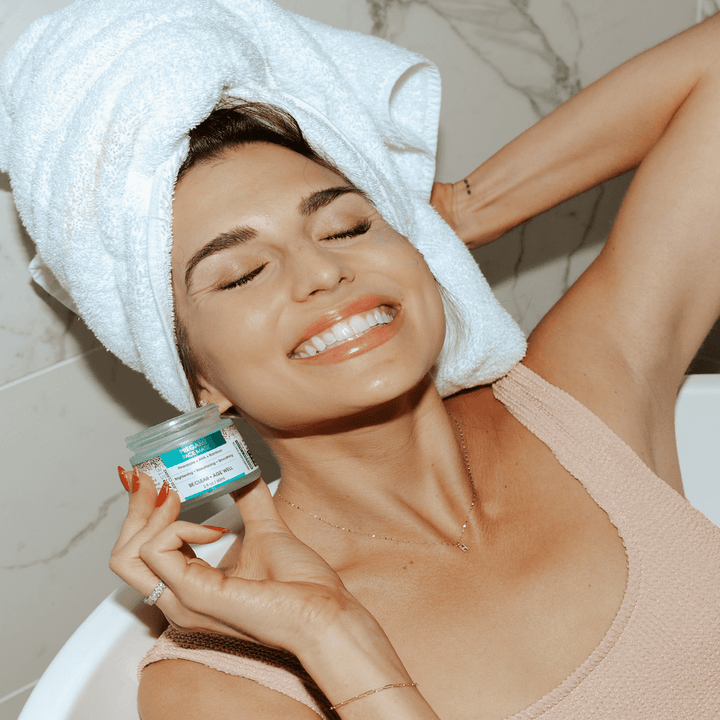 a model holding the face mask