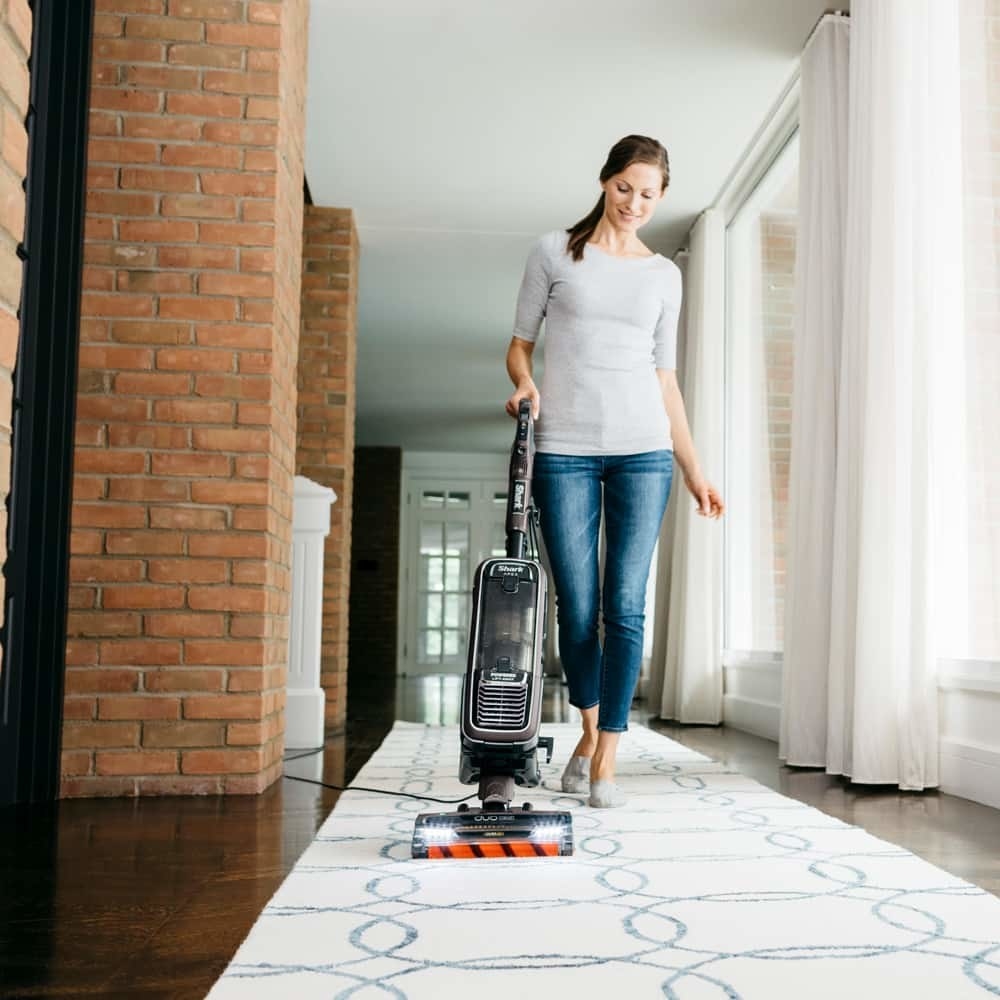 A woman vacuuming