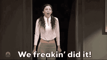 a gif of a a girl dancing and saying &quot;we freakin&#x27; did it!&quot;