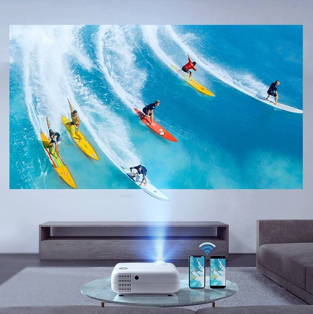 A projector streams people surfing from iPhones nearby