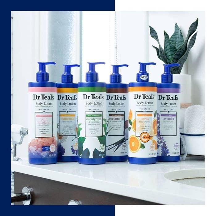 Six Dr. Teal&#x27;s body lotions in scents like eucalyptus, citrus and lavender sit on a bathroom counter.