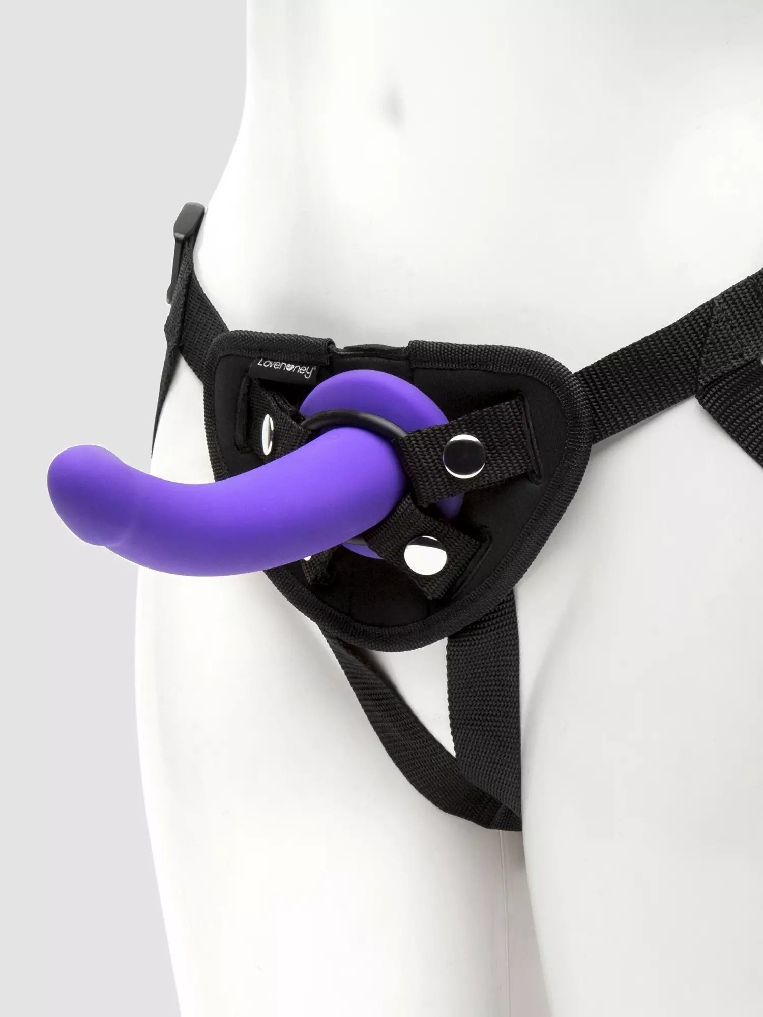 Mannequin wearing black harness with purple dildo