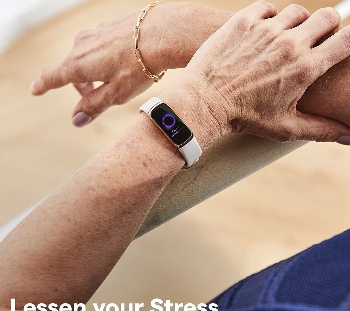 A person wearing the FitBit on their wrist