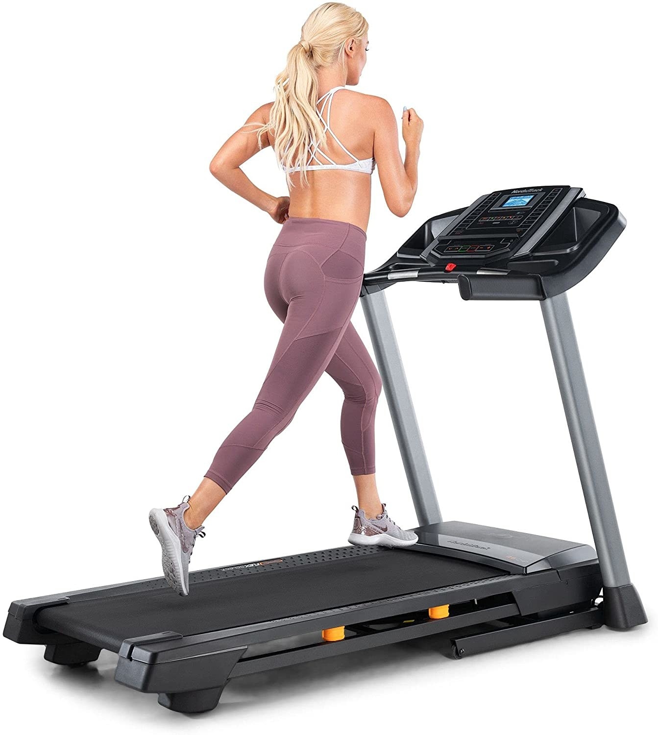 Model on a black treadmill with a screen display