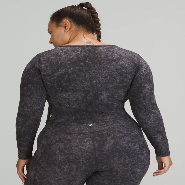 back view of the model wearing the shirt in Denim Wash Print Dusky Lavender Black