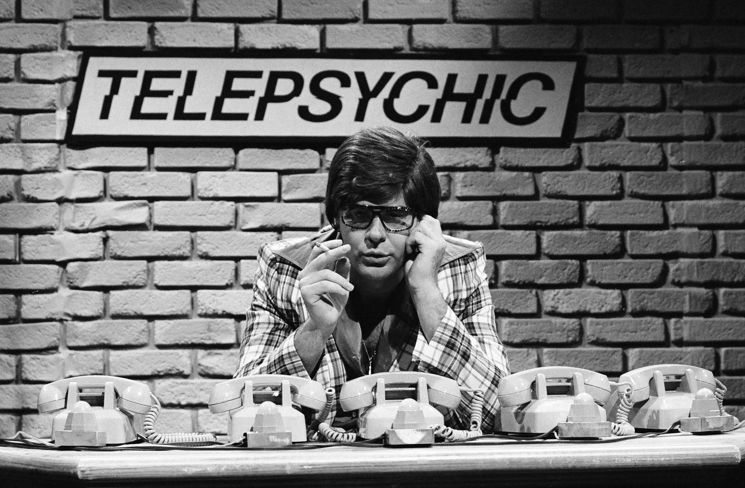 Dan Aykroyd on SNL with a &quot;Telepsychic&quot; sign behind him
