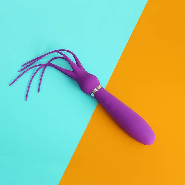 Purple octopus-shaped vibrator and mini flogger