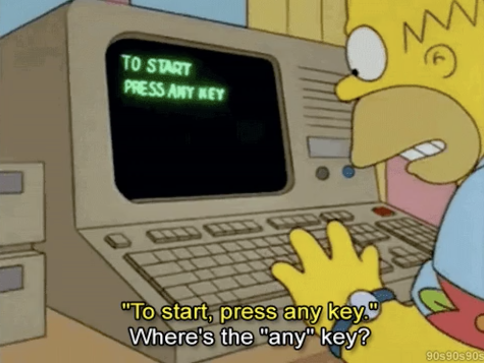 Homer Simpson struggling with a computer