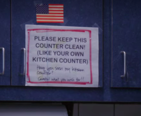 A close-up of the sign, with &quot;Have you seen my kitchen counter, careful what you wish for&quot; written on it