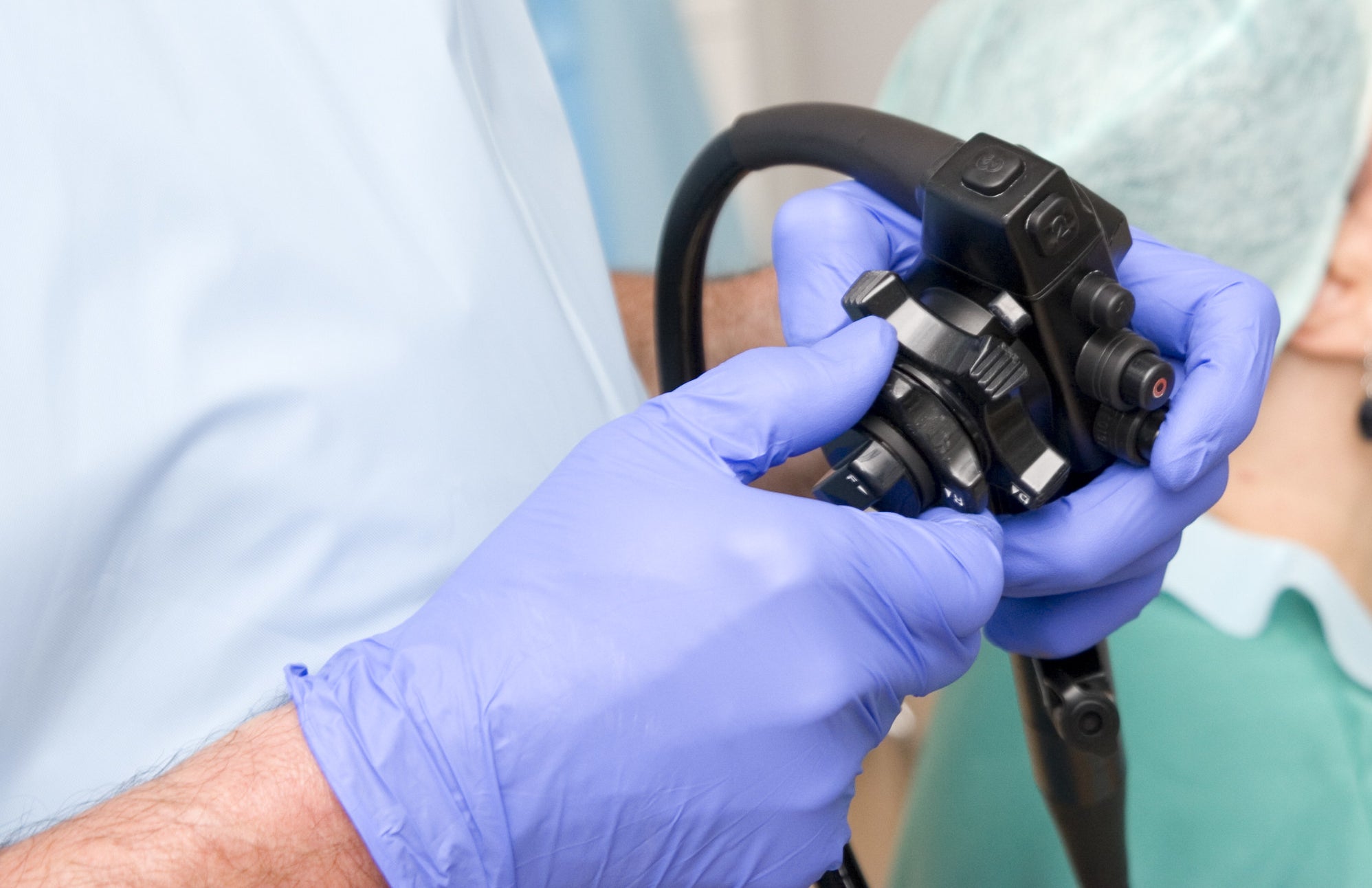 doctor holding colonoscope controls