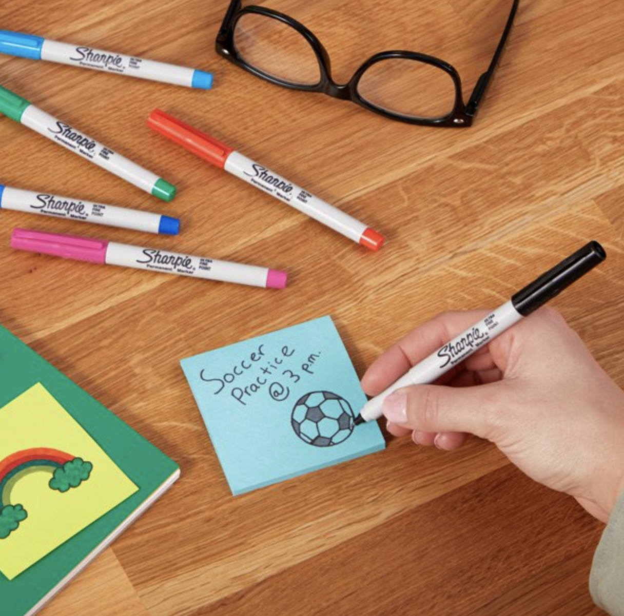 a model drawing with a sharpie on a sticky note