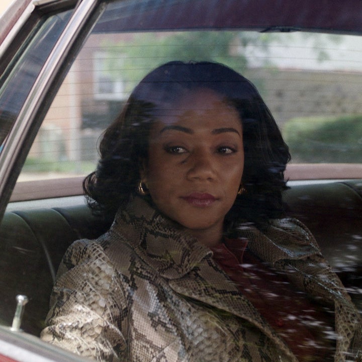 Tiffany looks out the back window of a car in a scene from The Kitchen