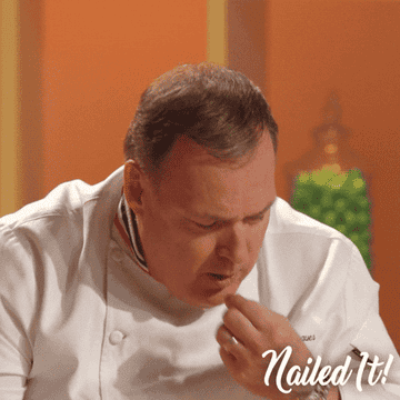 Chef Jacques Torres chewing and pulling something out of his mouth