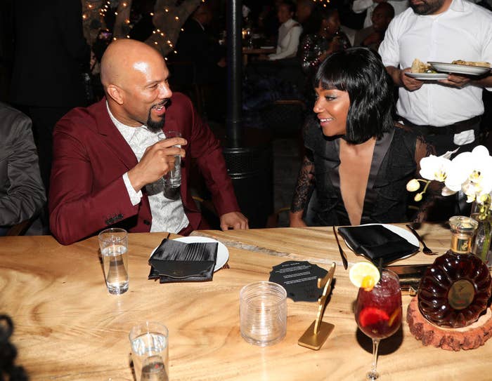 The couple looking at each other as they dine at an event