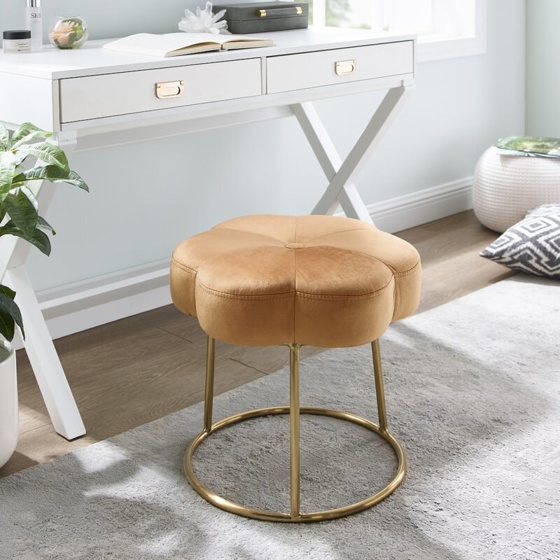 Orange vanity stool by a desk