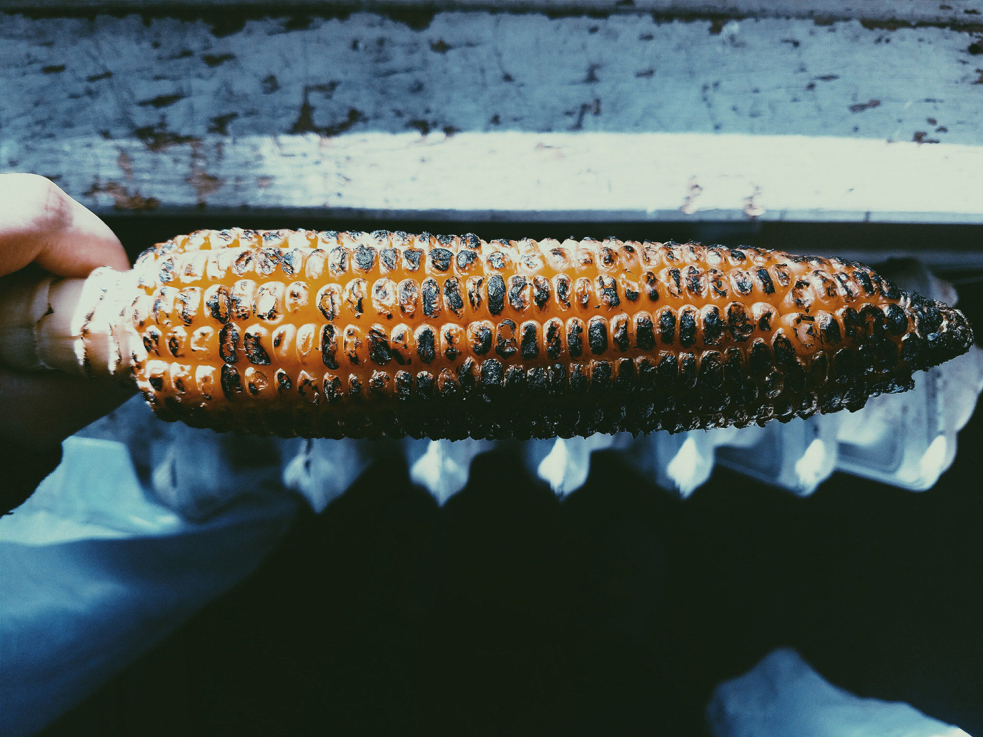 A charred corn on the cob.