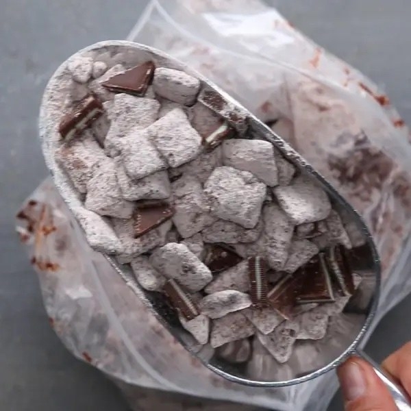 A scoop of mint chocolate snack mix.
