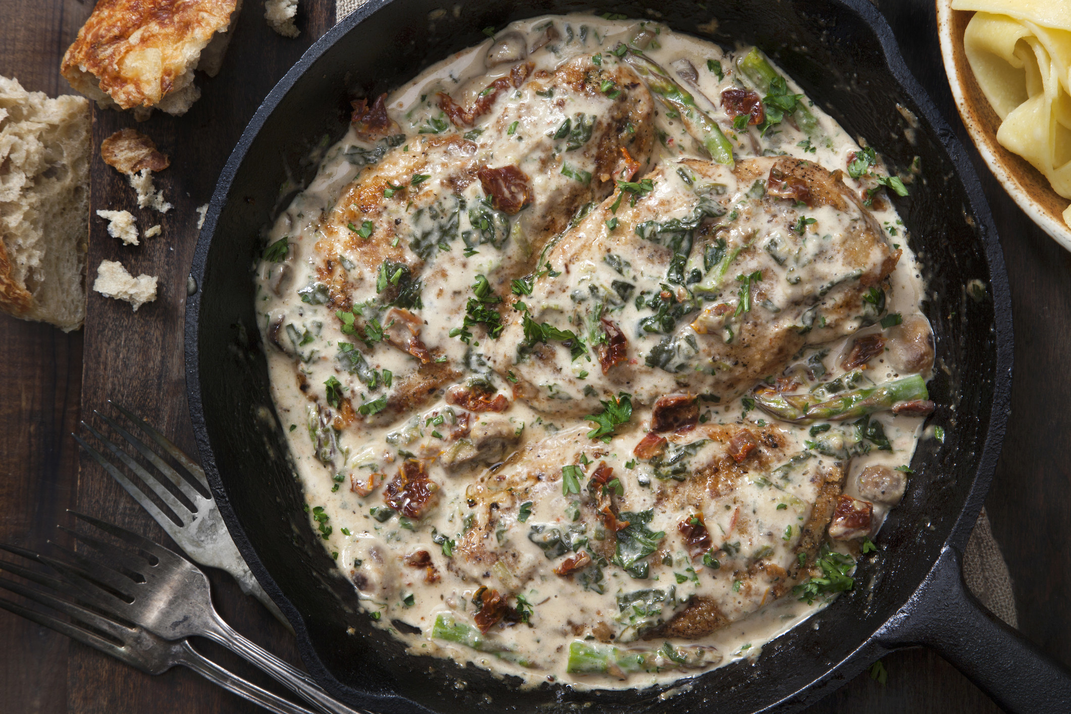 Tuscan Chicken in a Creamy Parmesan Sauce with Spinach and Sun Dried Tomatoes