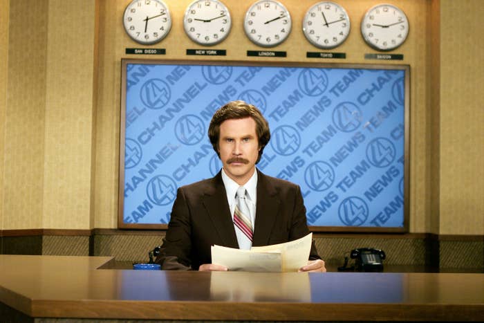 Will Ferrell sits at the anchorman&#x27;s desk as Ron Burgundy