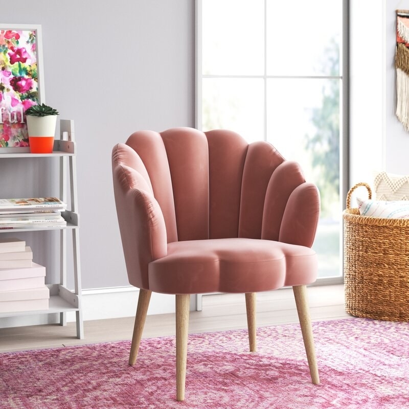 Pink accent chair shown in a room
