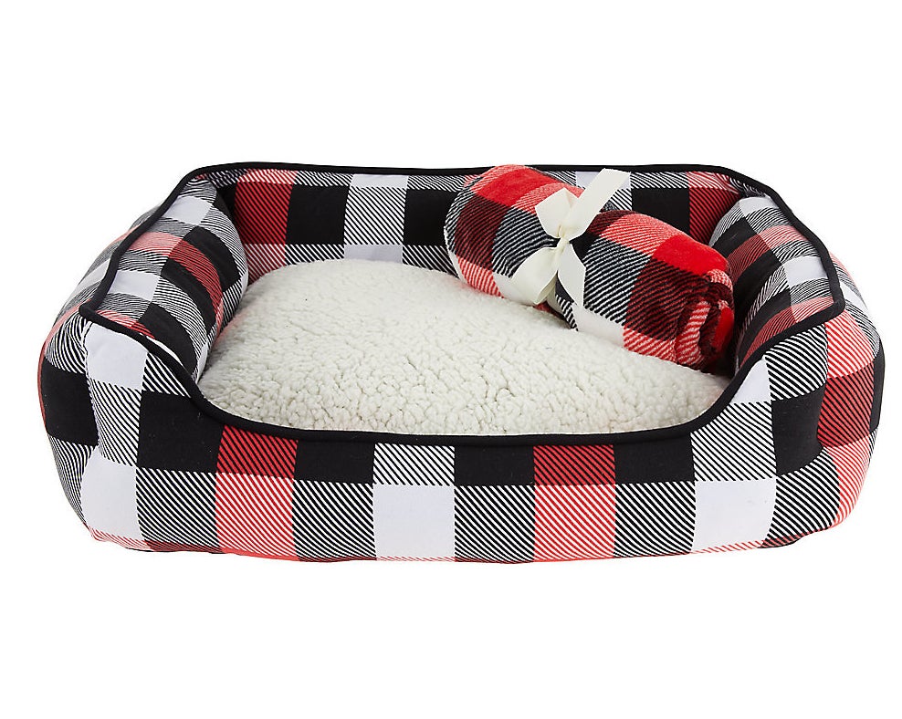 red black and white plaid bed with matching blanket