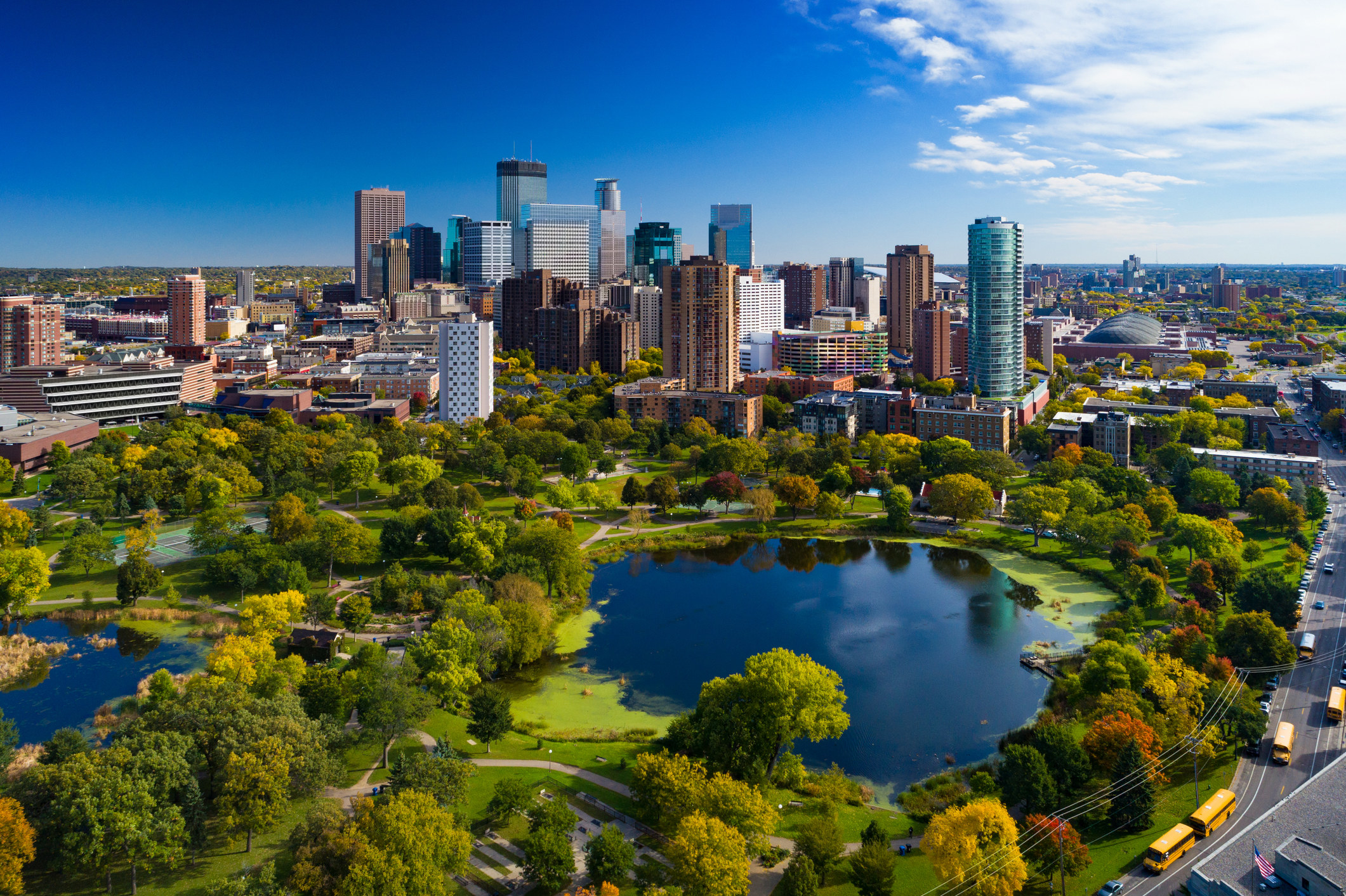 shot of the downtown Saint Paul, Minnesota area, with trees and ponds in the foreground