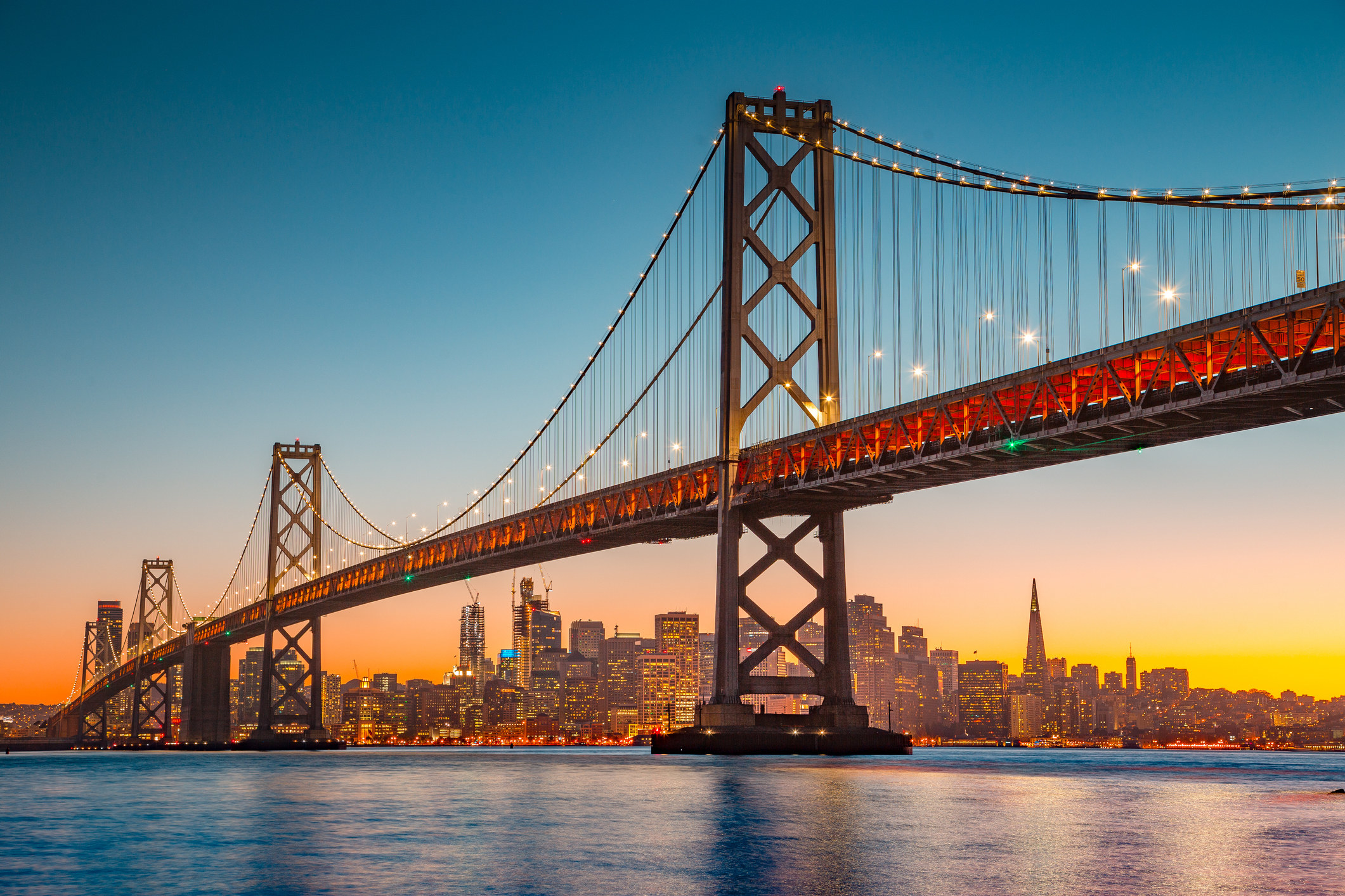 shot of San Francisco&#x27;s Golden Gate Bridge with downtown in the background