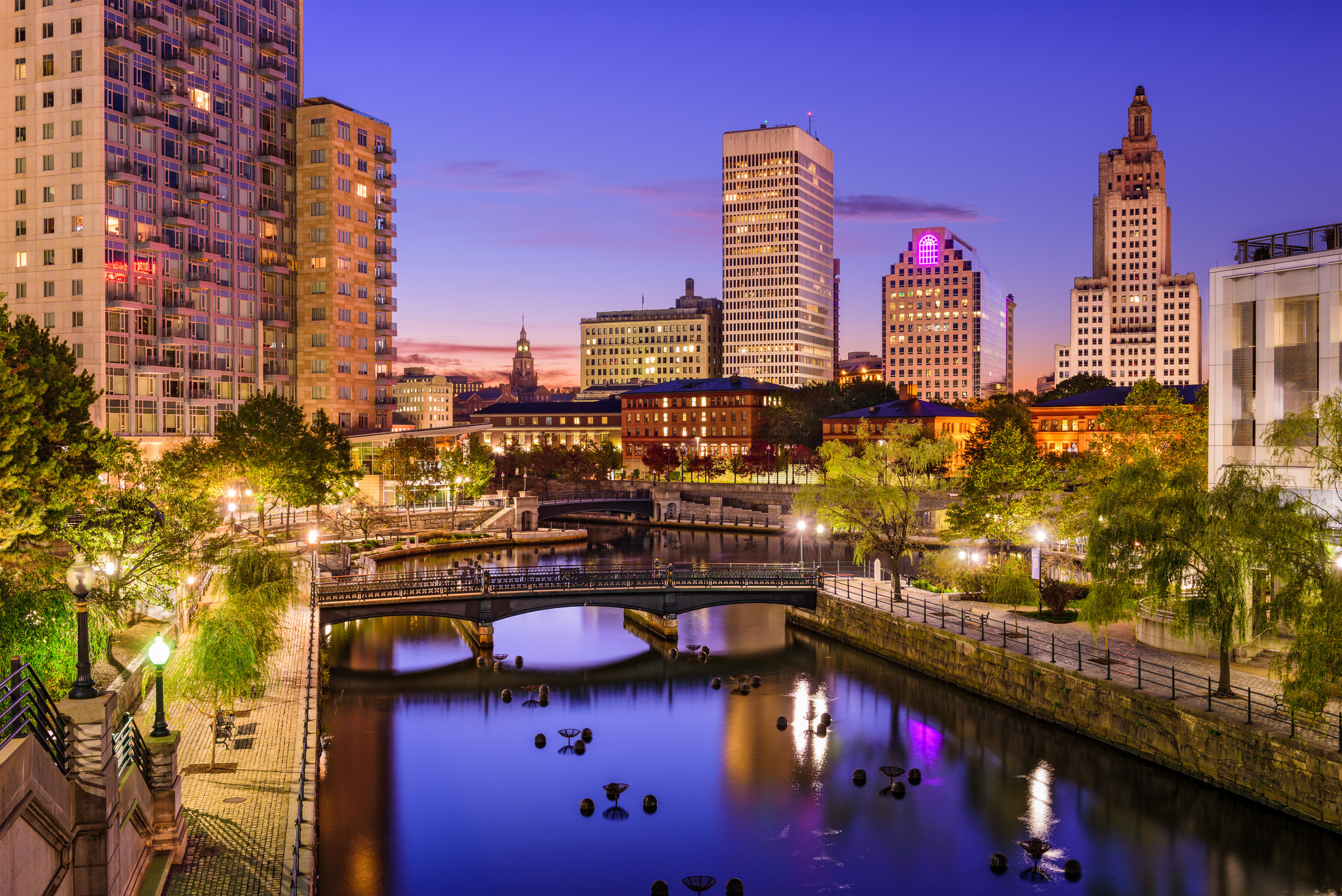 shot of Providence during dusk, there&#x27;s a bridge across one of the city&#x27;s waterways