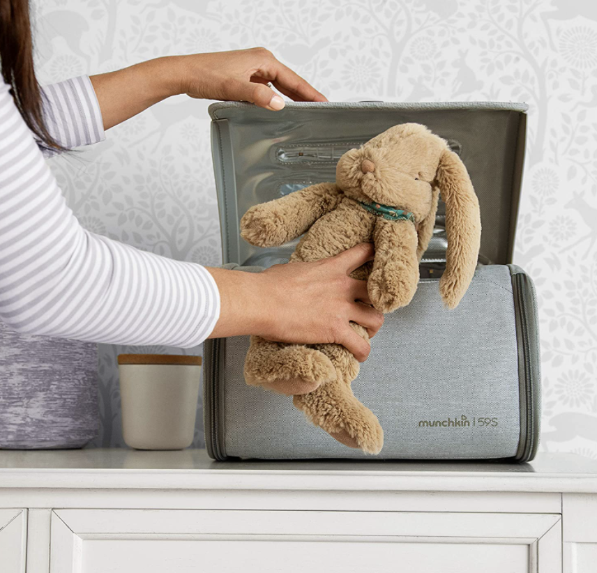 person using sterilization system for toy bunny