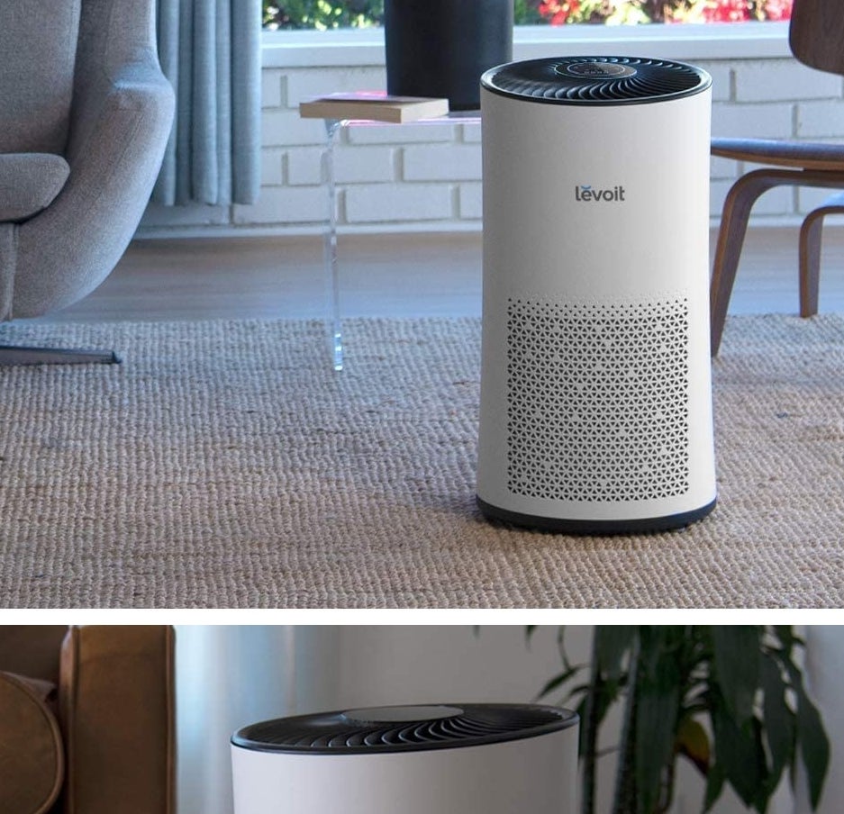 The air purifier on a carpet in front of a chair