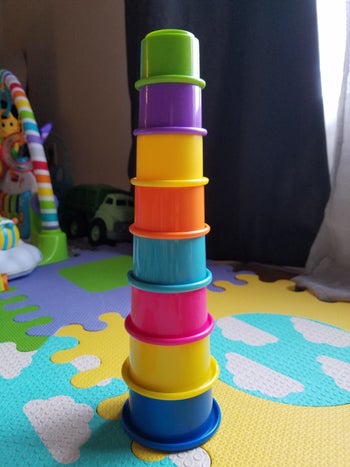 reviewer's photo showing the colorful cups stacked to form a tower
