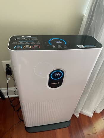 top down view of the white tower air purifier showing the touch screen