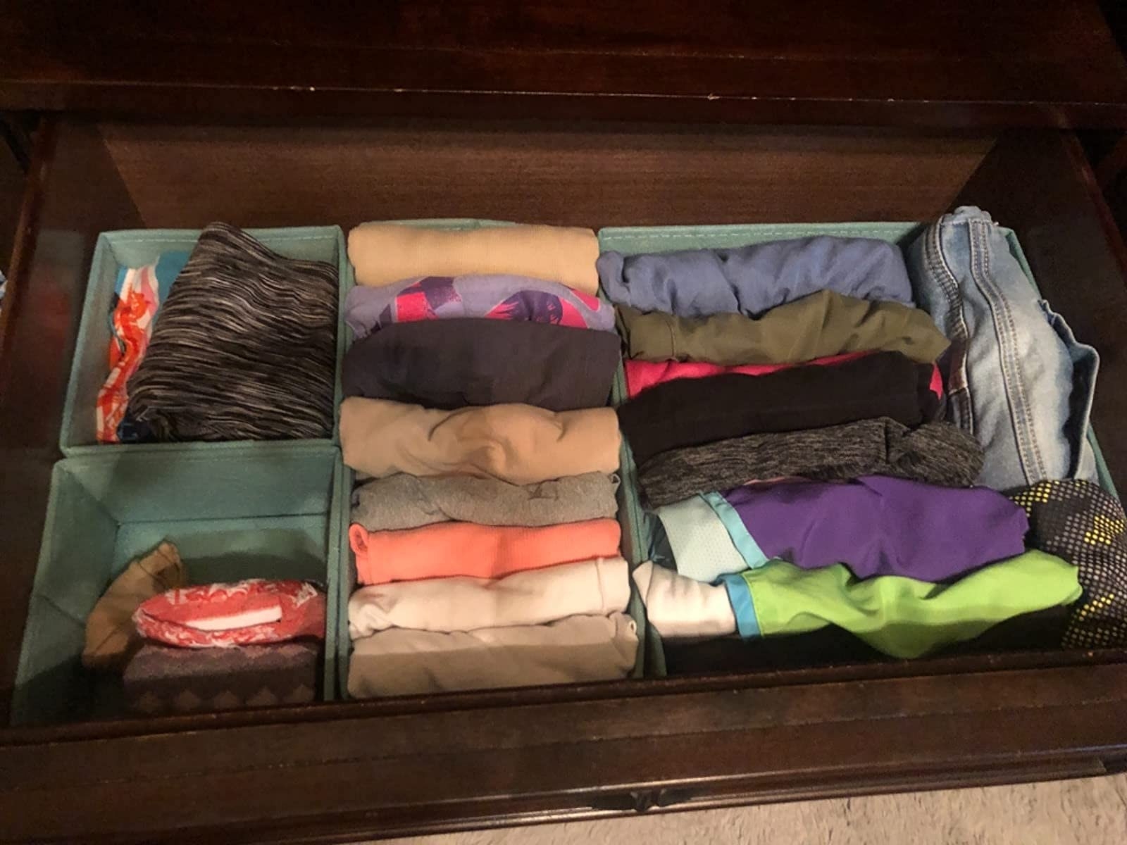 Several of the homyfort Clothes Drawer Organizer Dividers being used to organize clothes in drawers