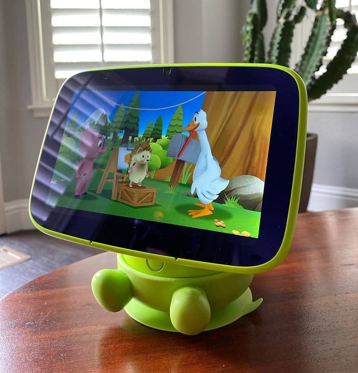 Reviewer image of green tablet with animal video sitting on table