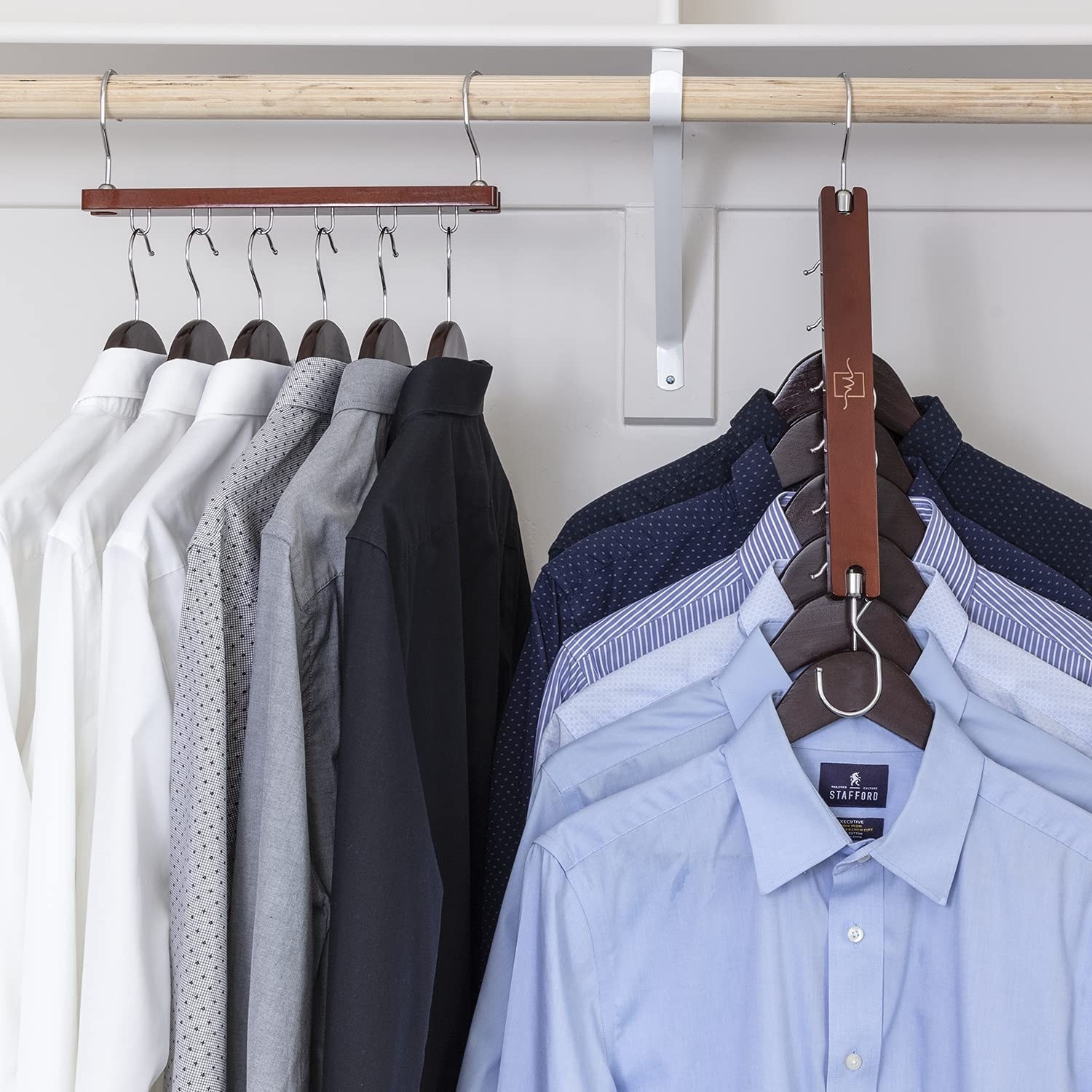 a pair of space-saving hangers holding several shirts