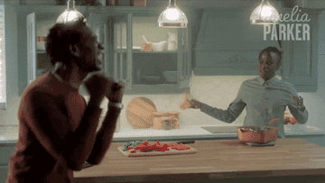 GIF man and woman freaking out in kitchen