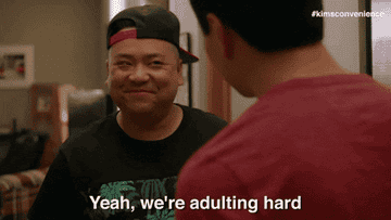 GIF man happy text reads yeah we&#x27;re adulting hard